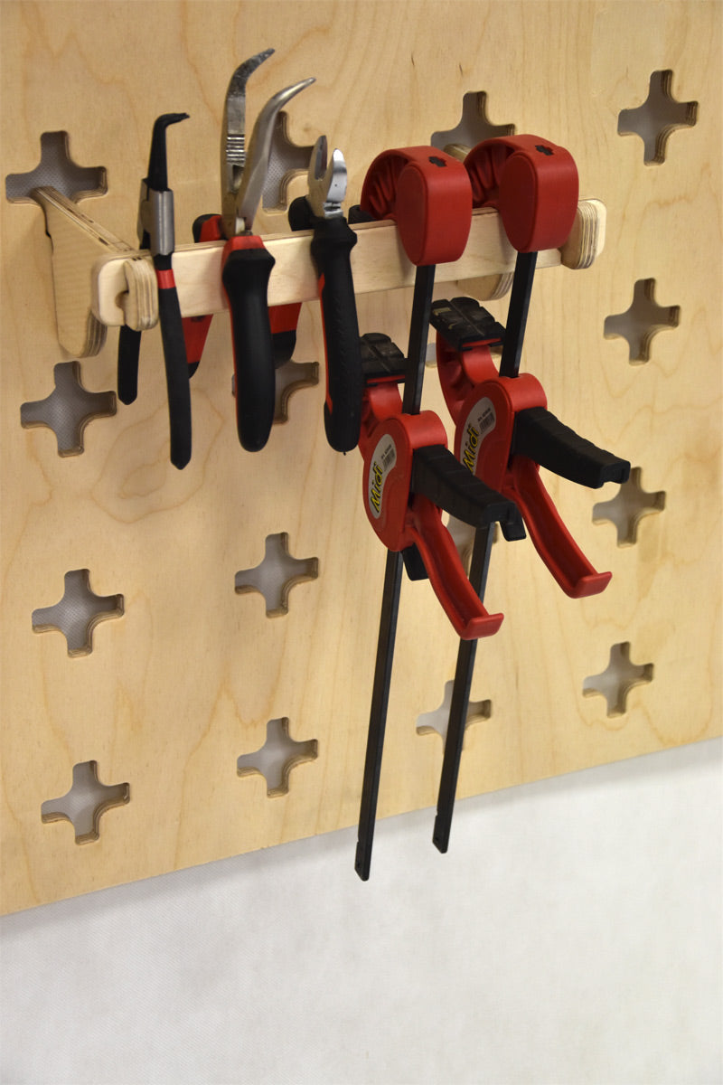 Wall-mounted holder for pliers