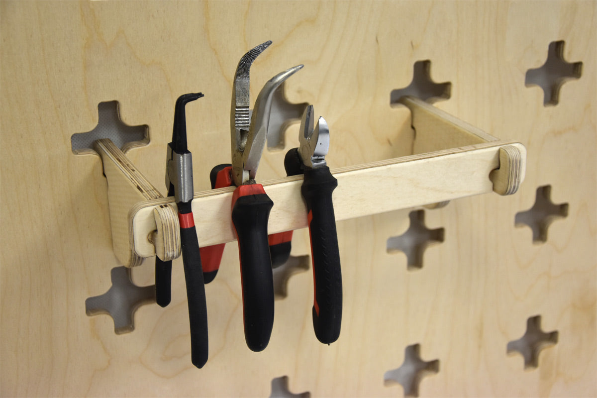 Wall-mounted holder for pliers